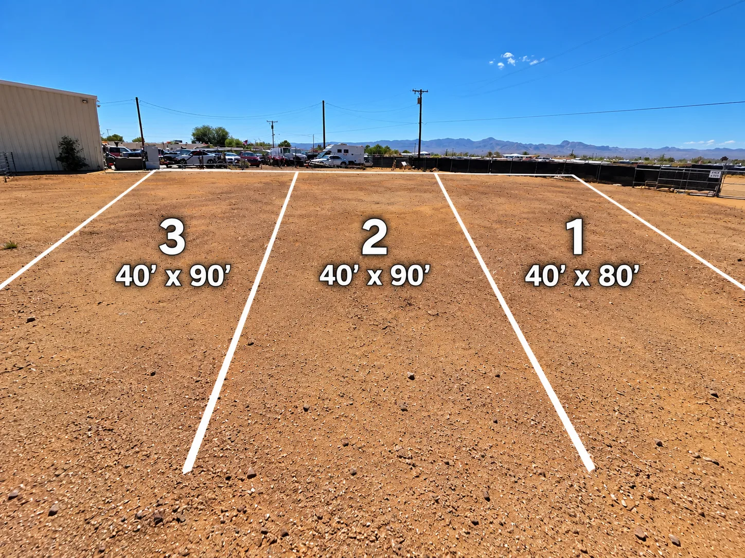 Three contractor yard spaces outlined with white lines on a graded dirt lot at Golden Valley Storage, labeled Space 3 40 by 90 feet, Space 2 40 by 90 feet, and Space 1 40 by 80 feet